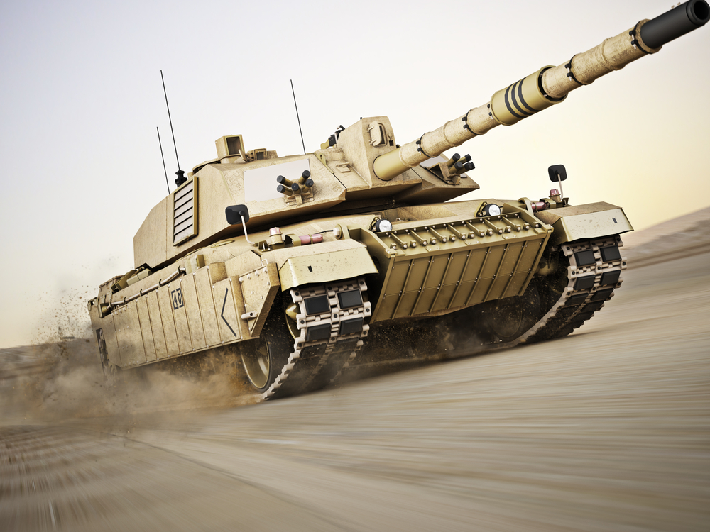 A tank driving through the desert, representing ex-military jobs abroad.